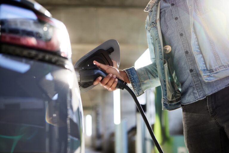 Man-plugging-in-cable