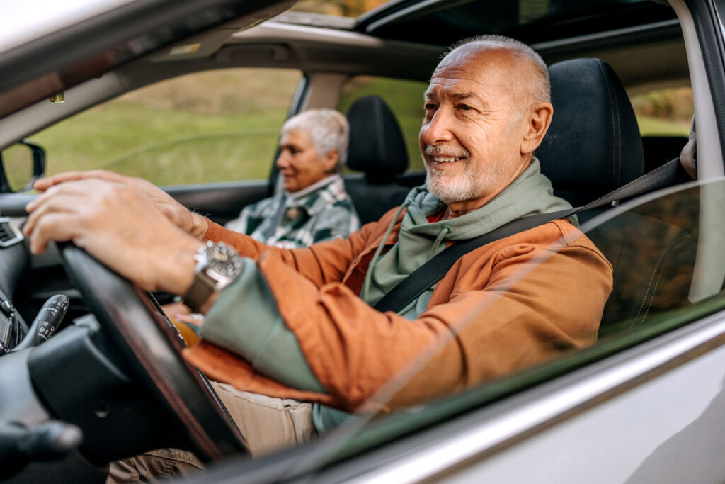 Senior couple on a road trip in a car together