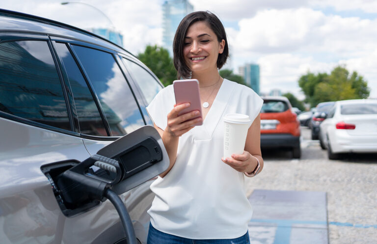 Woman-Charging-Electric-Car