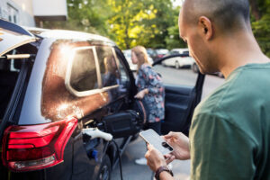 Man-Using-Smart-Phone-Car-Charging