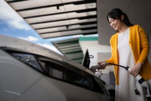 Women-PluggingIn-Electric-Vehicle