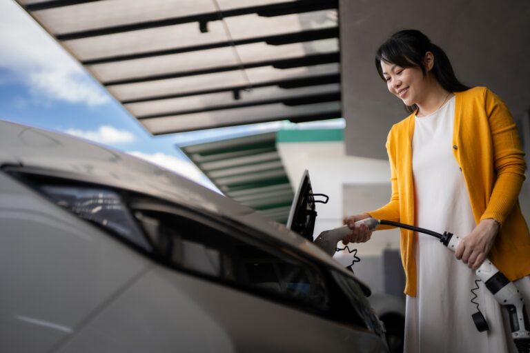 Women-PluggingIn-Electric-Vehicle